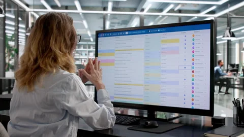 Women Using Online Spreadsheet Software For Data Coding Stock Footage 329680607
