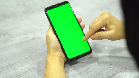 Women using smart phone slide finger green screen Stock Footage 113045124