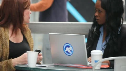 Women Using Technology at Cafe Stock Footage 11364308