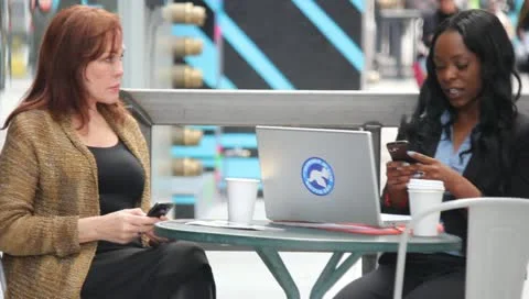 Women Using Technology at Cafe Stock Footage 11364323