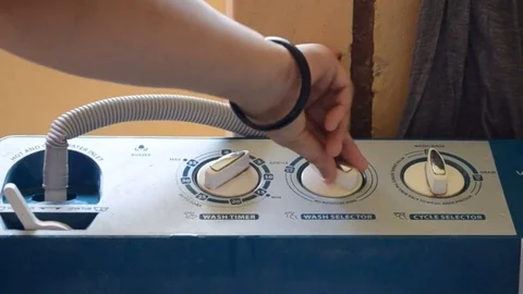 Women Using Washing Machine Stock-Footage 73818315