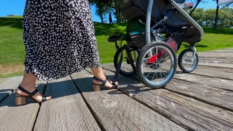 Women walking with a stroller Stock Footage 137456760