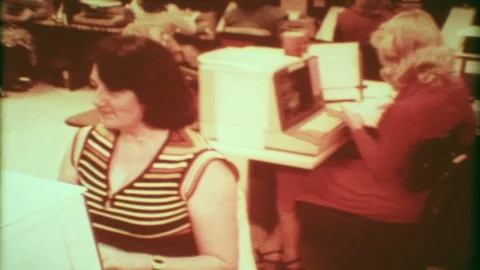Women work with new computers in busy office 1950s vintage film home movie 5227 Stock Footage
