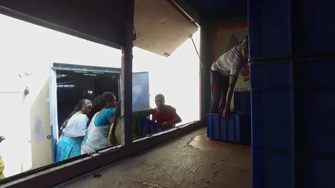 Women workers loading the incense stick crates to the vehicle Video stock 228429227