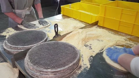 Women Workers Quickly making a Dough for Pizza on a industrial Bakery Plant. Stock Footage 166992241