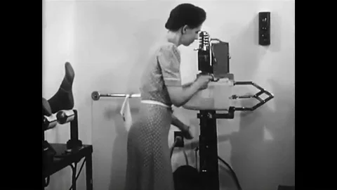 Women workers use a silk machine to develop more durable clothing, during World 動画素材 93332825