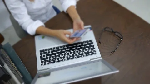 A women working with computer laptop on work desk Stockbeeldmateriaal 80134860