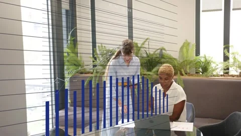 Women working on glass table tapping paper using device creating blue chart over Stock Footage 333255644