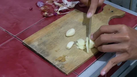 Women working on kitchen slice garlic Stock Footage 320274014