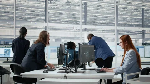 Women working in microchip factory lab training AI assistant Stock Footage 335880074