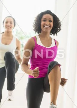 Women Working Out In Exercise Class