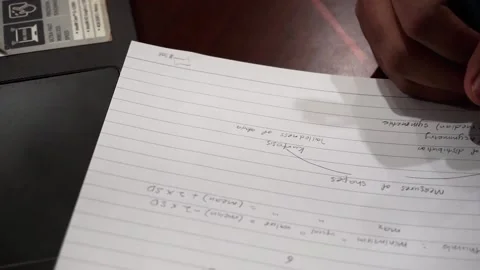 Women writing study notes on a paper with mechanical pencil. Stock Footage 143894322