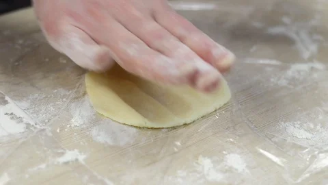Women's and children's hands shape the dough for heart-shaped cookies. Stock Footage 104442449