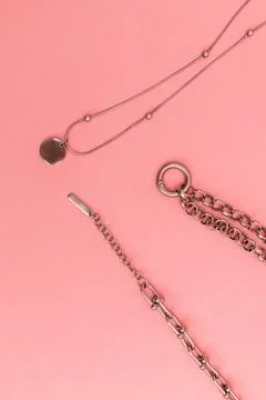 Women's bijouterie on pink background, object shot Stock Photos