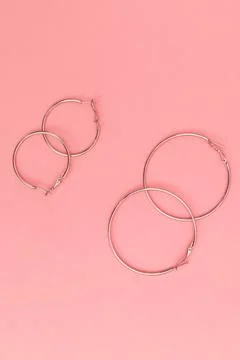 Women's bijouterie on pink background, object shot Stock Photos