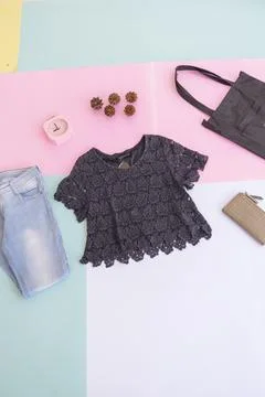 Women's clothing basic layout, Black Blouse on pale mint pastel background. L Stock Photos