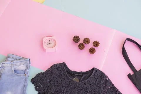 Women's clothing basic layout, Black Blouse on pale mint pastel background. L Stock Photos