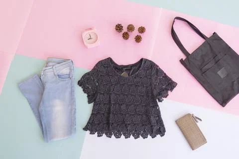 Women's clothing basic layout, Black Blouse on pale mint pastel background. L Stock Photos