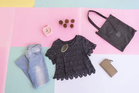 Women's clothing basic layout, Black Blouse on pale mint pastel background. L Stock Photos