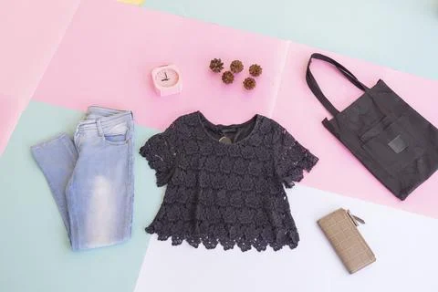 Women's clothing basic layout, Black Blouse on pale mint pastel background. L Stock Photos