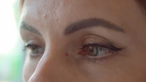Women's eyes close-up while reading. Vision problems. Stock Footage 246702662