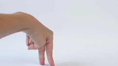 Women's fingers walking on a white background Stock Footage 167478125