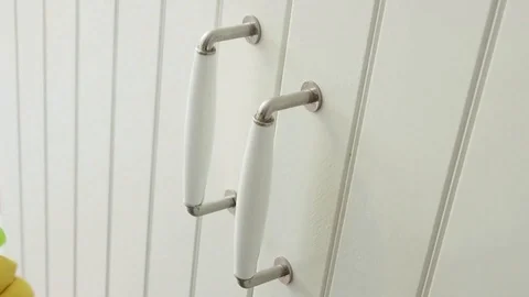 Women's gloved hands are sprayed with disinfectant and wipe with a cloth door Stock Footage 128698014