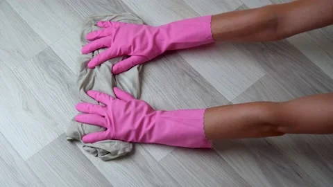 Women's gloved hands with a rag wash the floor laminate Stock Footage 202175232