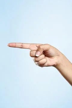 Women's hand pointing to the side Stock Photos