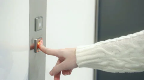 Women's hand presses button. elevator doors closed Stock Footage 64056162