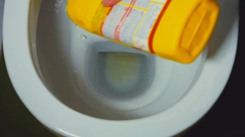Women's hands are applied to clean the toilet under the rim of the toilet Stock Footage 103462227