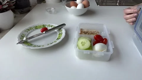 Women's hands are closing a lunch-box with a healthy meal Stock Footage 171806095