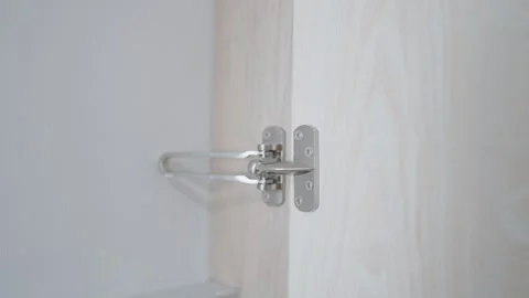 Women's hands are locked. Lock the white door in the hotel for your own safety.  Stock Footage 273134786