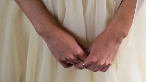 Women's hands on the background of tender wedding dress 動画素材 78996262