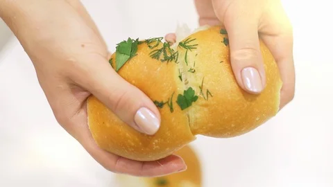 Women's hands breaking bread Stock-Footage 97823610