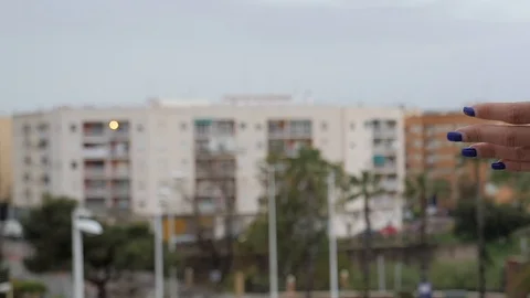 Women's hands clapping from their balcony Stock Footage 128975036