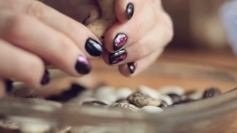 Women's hands clean dried beans Видео 97834852