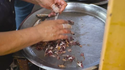 Women's hands clean small fish with their hands at the fish market. Fish Video stock 201070446
