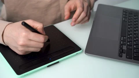 Women's hands close-up drawing on graphic tablet, remote creative work online Stock Footage 170584542