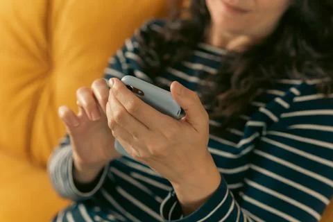 Women's hands that confidently hold a smartphone, modern technology Stock Photos