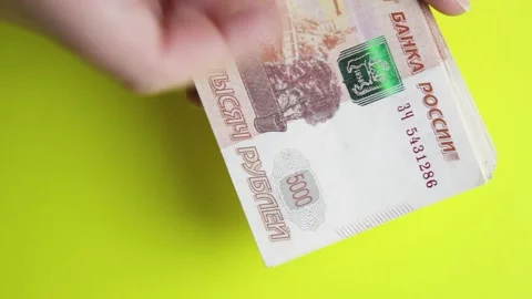 Women's hands count Russian banknotes with a face value of five thousand rubles. Stock Footage 155085684