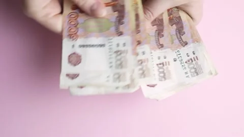 Women's hands count Russian banknotes with a face value of five thousand rubles. Stock Footage 155085768