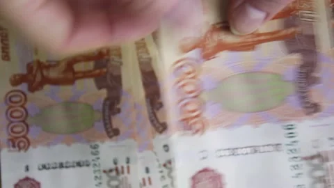Women's hands count Russian banknotes with a face value of five thousand rubles. Stock Footage 155085834