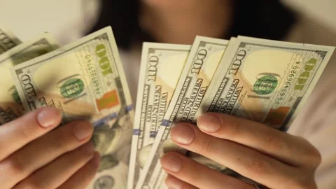 Women's hands counting dollar bills. Close-up Stock Footage 283915307