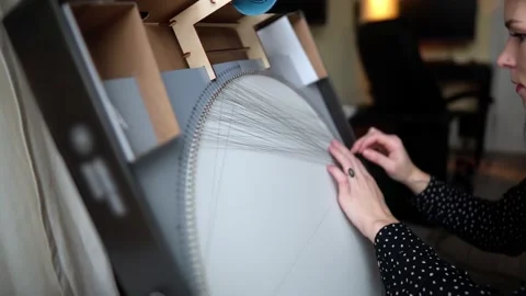 Women's hands create a picture with threads Stock Footage 169625247