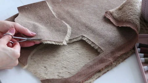Women's hands create a textile product, toy, pattern Stock Footage 88229798