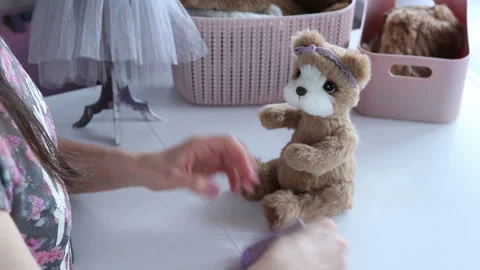 Women's hands create a textile product, toy, pattern Stock Footage 88230532