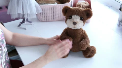 Women's hands create a textile product, toy, pattern Video stock 88231183