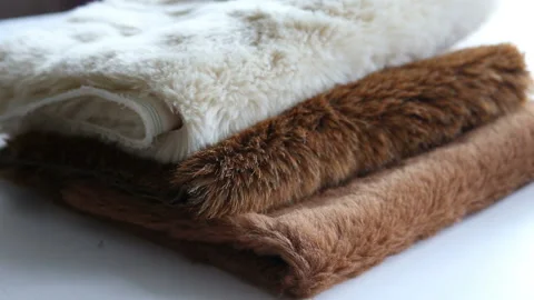 Women's hands create a textile product, toy, pattern Video stock 88231667