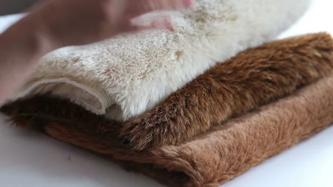 Women's hands create a textile product, toy, pattern Video stock 88231785